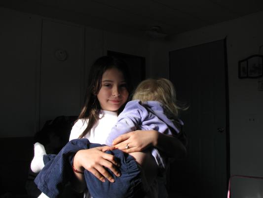 Malia holds Sarah.