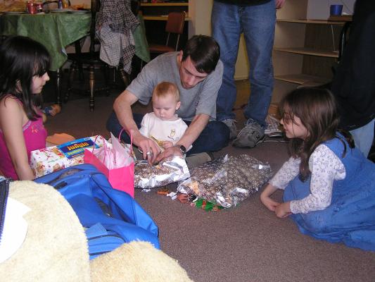 Sarah and David open presents.
