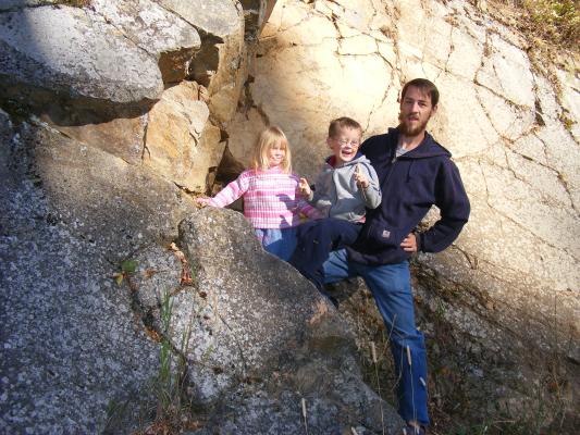 Sarah, Noah and David like to play on big rocks.