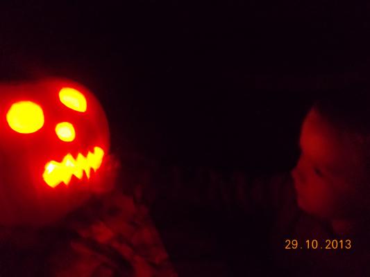Joshua checks out his Jack-o-lantern