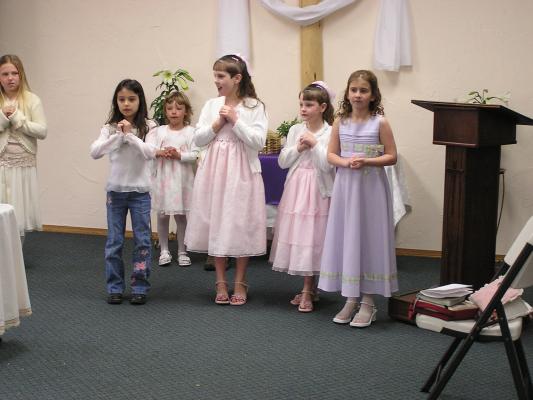 The girls practice their song for Church.