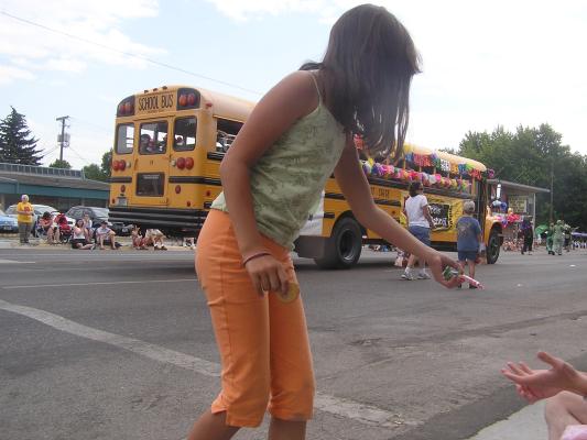 Sweet Pea Festival Parade. Malia gives David some candy