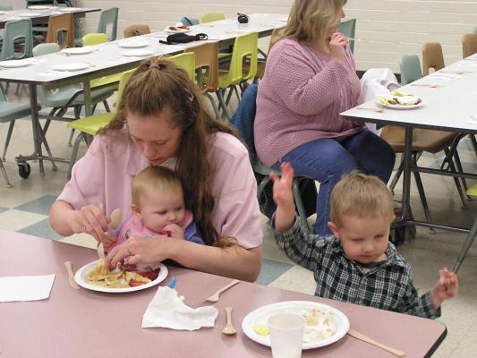 Katie, Sarah and Noah eat Easter breakfast.