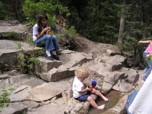 Everyone plays at the top of the falls.