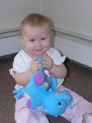 Sarah plays with her new elephant.