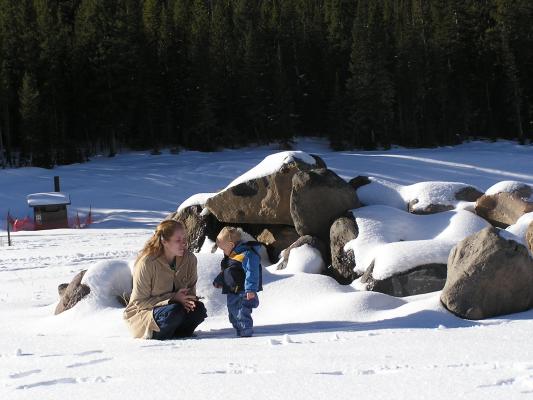 Katie and Noah play in the snow.