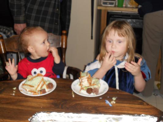 Joshua and Sarah eating cake. 