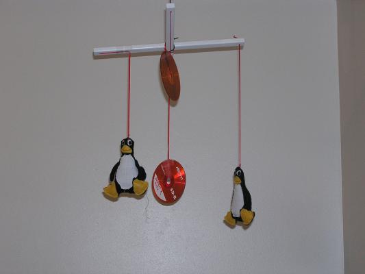 Noah's Redhat linux CD and Tux mobile.