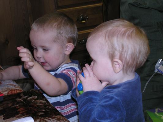 Noah and Sarah play with Steven's toys.