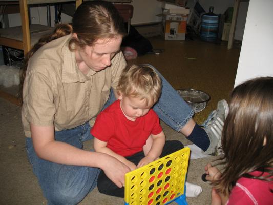 Noah and Andrea play connect four.