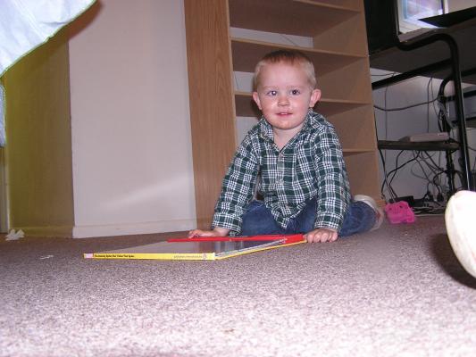 Noah loves his new noisy Spiderman book.