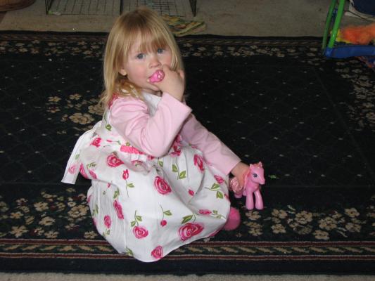 Grandma Eder got Sarah a pretty dress. Grandma Cline got her a pony.