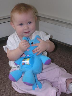 Sarah plays with her new elephant.