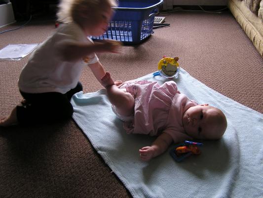 Noah plays with Sarah.