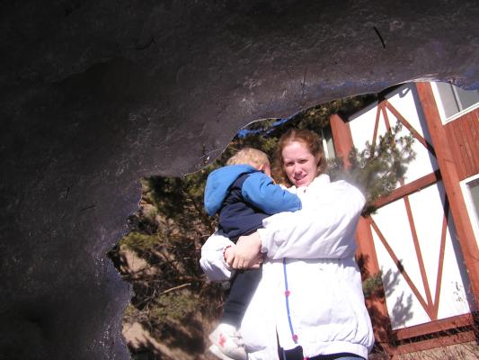 Katie and Noah look into the snow fort.