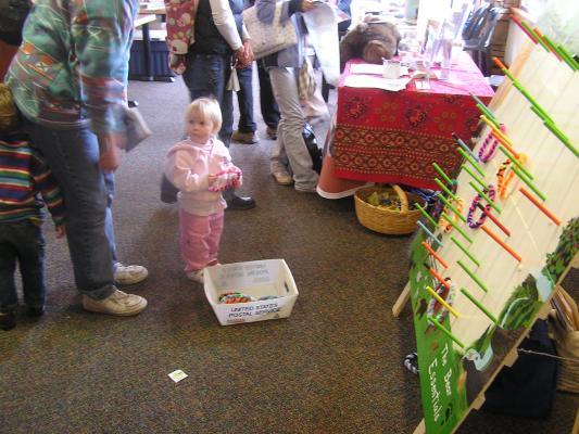 Sarah plays a ring toss game