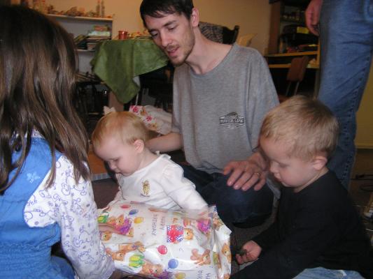 Sarah and David open presents.