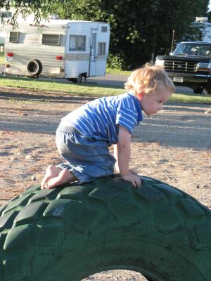 Noah by the green tire