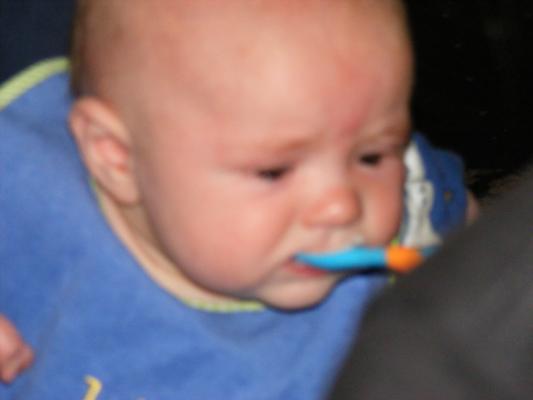 Joshua eats rice cereal