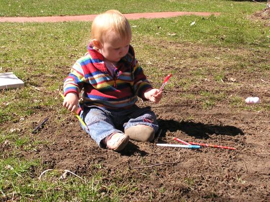 Sarah plays in the dirt.