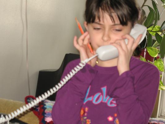 Malia talks on the phone.