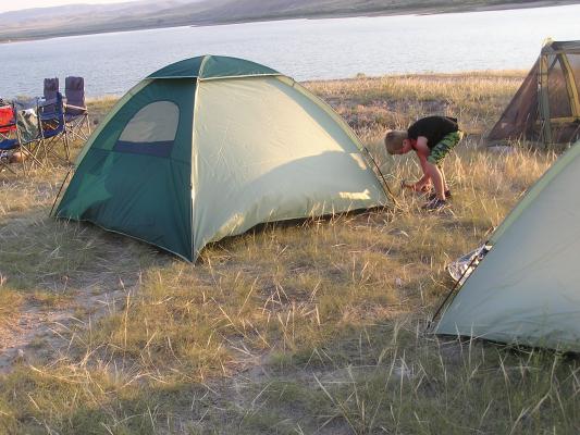 Tanner hammers a tent stake at the Gallatin Valley Christian Church Campout.