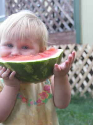 Sarah eats some watermelon.