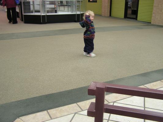 Noah runs around in the mall.