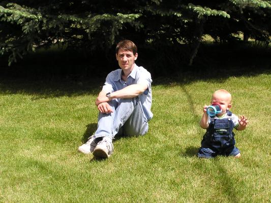 David and Noah on the grass.