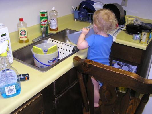 Noah washes the strainer.