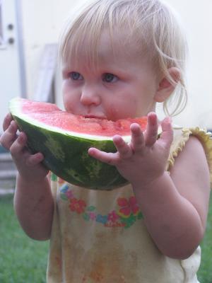 Sarah eats some watermelon.