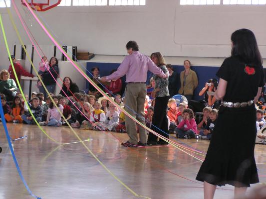 Miss Jones (Malia's teacher) receives 
and her class receive a prize for gathering the most 