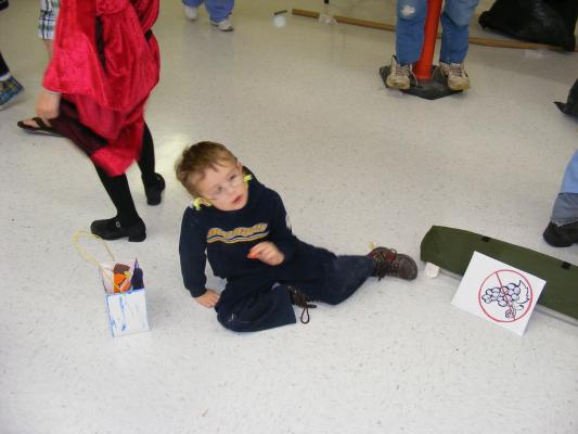 Noah plops down and eats some candy.