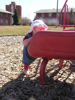 Sarah climbing into the slide.