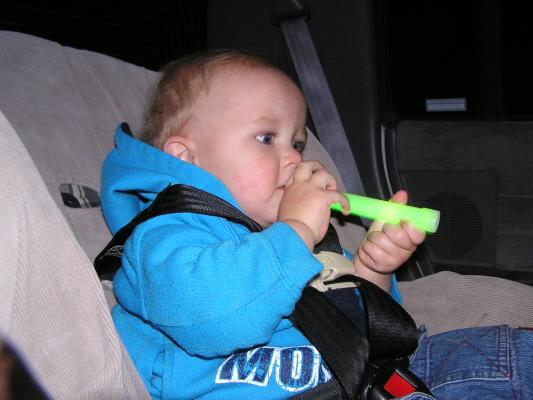 Noah plays with a glow stick.