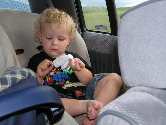 Noah studies his sock.