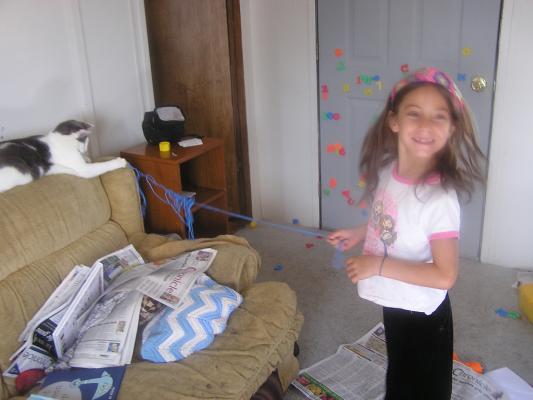 Andrea plays with the cat