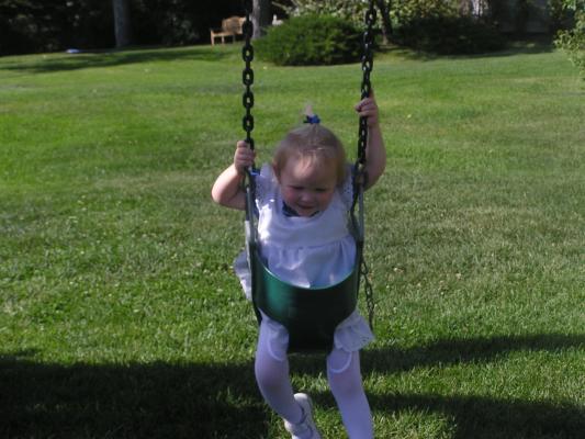 Sarah swinging at our neighbor's wedding.