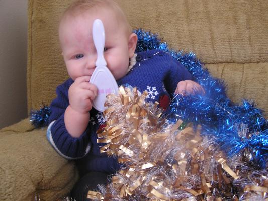 Trying to get a good Christmas photo of Sarah.
She has a new blue sweater.