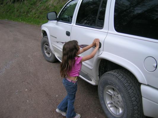 Andrea opens the door the the car. It is Matthew's car.