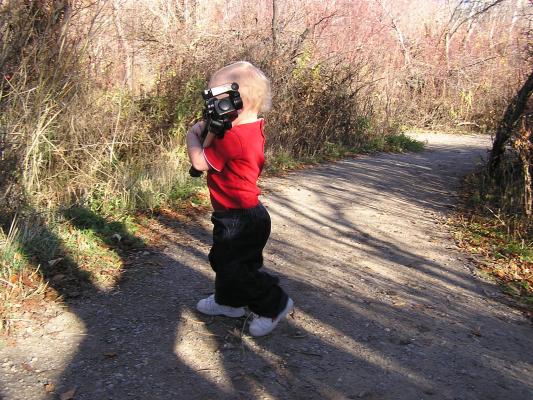 Noah carries the tripod.