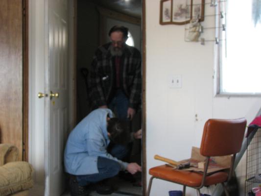 David and Robert fix the door.