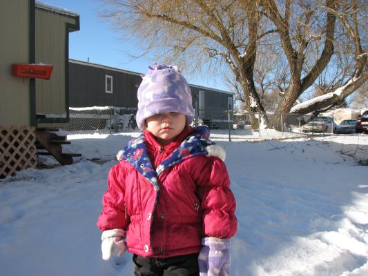 Sarah plays outside in the snow.