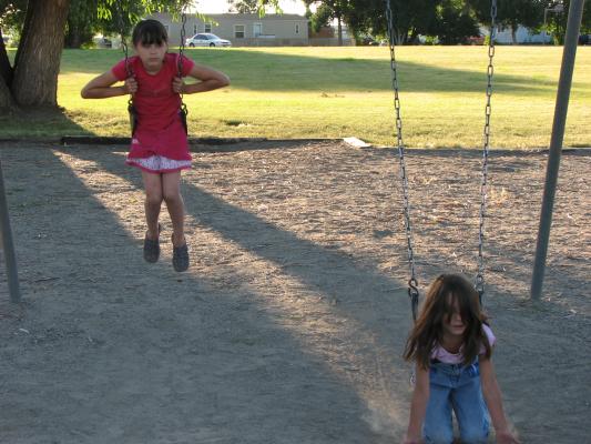 Malia and Andrea swinging