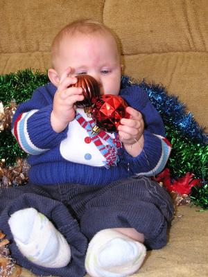 Sarah is eating two Chrismas balls