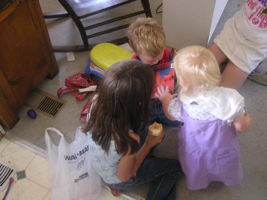 Noah Andrea nd Sarah check out his new toy