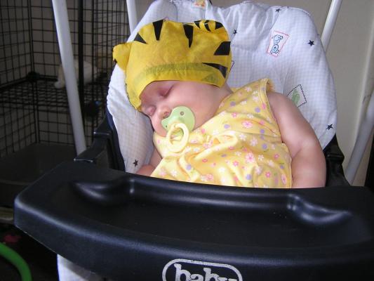 Sarah wears Noah tiger hat.