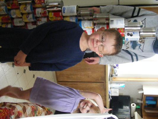 Noah and Sarah helped stack some olives and chili