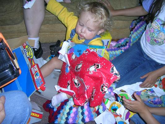 Noah needs a whole lot of help opening presents.