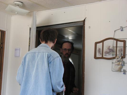 David and Robert fix the door.